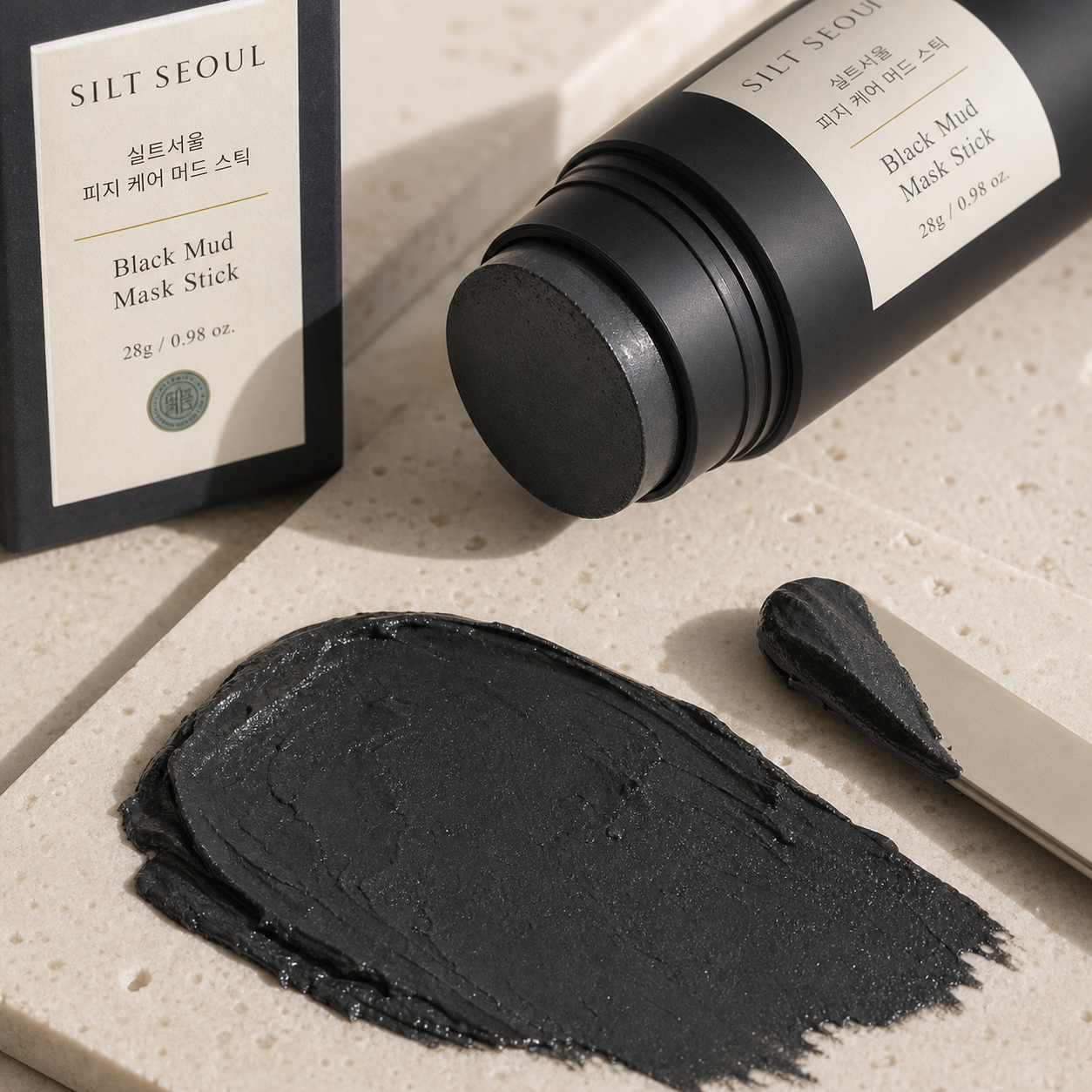 SILT SEOUL Black Mud Mask Stick texture close-up with charcoal clay smear